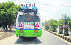 Travelling on the rooftop of buses is a common sight in Fatehabad.