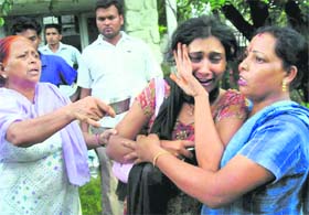 Relatives of a stampede victim mourn outside the Anandpur Sahib civil hospital