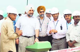 Chief secretary Ramesh Inder Singh presses the button of a rolling unit at under-construction refinery near Bathinda