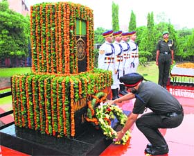An officer lays a wreath at the memorial to Major Sandeep Shankla on his martyrdom day at Panchkula