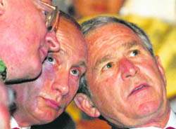 US President George W. Bush and Russia's Prime Minister Vladimir Putin were all attention as the dazzling opening ceremony unfolded.