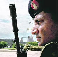 A policeman keeps vigil around the capitol complex, a week ahead of the Independence Day, in Chandigarh on Saturday.