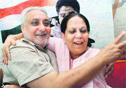 The proud parents of Abhinav Bindra, A S Bindra and Babli Bindra, celebrate in Chandigarh on Monday.