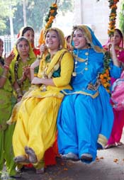 Students of BBK DAV College celebrate Teej in Amritsar.