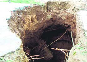 The sewer line that collapsed due to rain on the road dividing Phase 3B-1 and Phase 7 in Mohali
