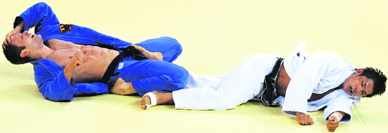 Ole Bischof of Germany (blue) celebrates after defeating Kim Jaebum of S. Korea during mens 81kg judo final.