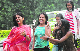 Students of GCG-11 enjoy the rain in Chandigarh on Thursday.