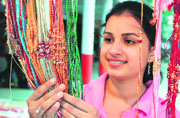 A girl selects rakhi on the eve of Raksha Bandhan in Chandigarh on Friday.