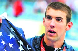 US swimmer Michael Phelps poses after the mens 4 x 100m medley relay final medal ceremony at the National Aquatics Center during the Beijing Olympic Games. He won the eighth gold medal on Sunday bettering the record of Mark Spitz, whose seven swimming golds at Munich in 1972 were the most at a single Games.