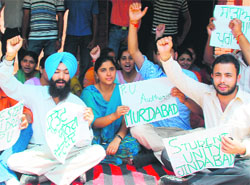 PUSU activists and students of Punjabi department sit on a dharna outside the department on PU campus on Monday.