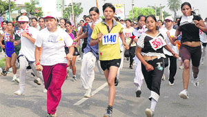 Youngsters participate in national half-marathon of 21 km for men and women on the occasion of Rajiv Gandhi Akshay Urja Divas celebrated at Panchkula on Wednesday.