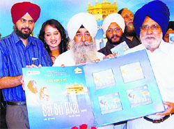 Lok Sabha deputy speaker Charanjeet Singh Atwal releases music album of the upcoming movie Sat Sri Akal in Chandigarh on Wednesday.