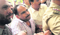 Sanjeev Bansal, former Haryana law officer, being produced in court in Chandigarh