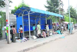 ILLEGAL BUSINESS: A bus stop in Panipat being used to sell commodities by local hawkers.