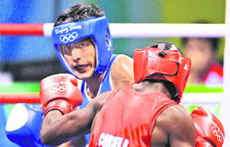 Vijender Kumar (blue) fights Emilio Correa Bayeaux of Cuba during a mens middleweight 75 kg semifinal bout at the Beijing Olympics in Beijing on Friday. Bayeaux defeated Vijender 8-5. 