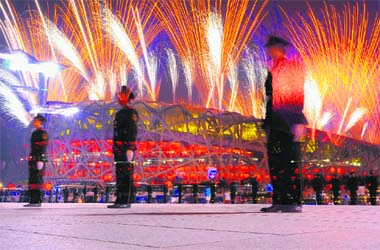 Fireworks light up the sky over the National Stadium, also known as the Birds Nest, at the start of the closing ceremony of the Beijing Olympic Games