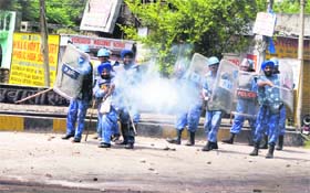RAF personnel fire teargas shells on a mob in Digiana in Jammu