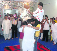 Members of the Hindu community celebrate Janmashtami for the first time at the Krishna Temple in Lahore on Sunday.