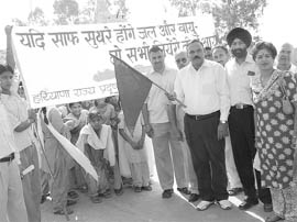 Sarpanch of Sullar village flag off an awareness rally on environment near Ambala on Thursday.