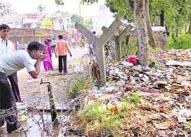 Unhygienic: A water tap for residents of Nayagaon, provided by the Chandigarh Municipal Corporation, is adjacent to a garbage dumping site