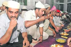 Muslims at an iftar party on the first day of Ramzan at Jama Masjid