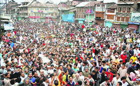 Kashmiris carry the coffin during the funeral of 20-year-old Javaid Iqbal Bhat who was killed when the police opened fire on protesters during a strike call against the arrest of senior Hurriyat leaders, in Srinagar on Saturday.