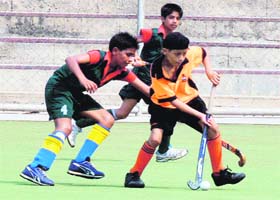 A match between Malwa School Hockey Wing, Ludhiana, and Moga in progress on the PAU campus
