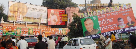 Hoardings eclipse statue of Shaheed Udham Singh near the Hall Gate. Is anybody watching?