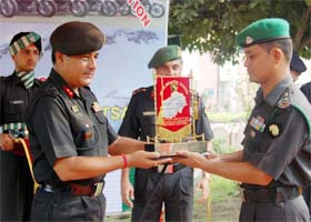 Maj-Gen and General Officer Commanding of Panther Division P.S. Paul hands over the flag to the in charge of the 16-member expedition team in Amritsar