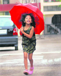 A child enjoys the shower that lashed Chandigarh on Wednesday evening.