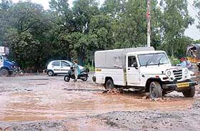 A damaged section of the Zirakpur-Kalka Highway following incessant rain