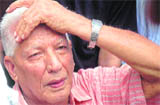 Narottam Sharma, 80-year-old father of Delhi police (special cell) officer Mohan Chand Sharma grieves at the funeral of his son.