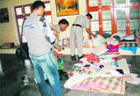 Police looking for clues in the room in Chotta Rampur village near Herbertpur in Dehra Dun district where two Christian Missionaries were found dead on Monday.