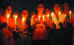 Students of the St Soldier group of colleges light candles to observe Girls’ Day in Jalandhar on Tuesday.