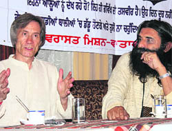 US scientist John Fagan and executive director of the Kheti Virasat Mission Umendra Dutt discuss ill-effects of genetically modified crops in Bathinda on Saturday.