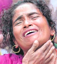 Rekha Devi, wailing mother of 13-year-old boy Santosh who was killed in a bomb blast