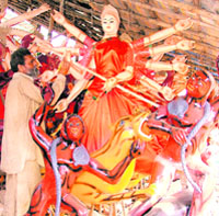 An artist in Ludhiana gives final touches to idols for the Navratras, which begin on Tuesday.