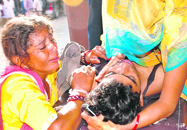 A woman breaks down on seeing the body of her son, who was killed in the temple stampede, at a hospital in Jodhpur on Tuesday.