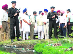 Chief Minister Parkash Singh Badal inspects the Badi Nadi area near Taffzalpur in Patiala on Wednesday.