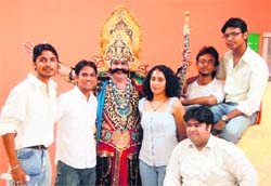 Designs on the devil: The team which designed the costume poses with ‘Ravana’