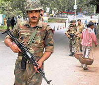 Security personnel patrol a street in Agartala on Wednesday.