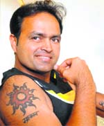 Spirituality and sportsmanship go hand in hand. That’s what cricketer Dinesh Mongia’s tattoo depicting the Surya motif seems to say.Lifestyle photo:Pradeep Tewari