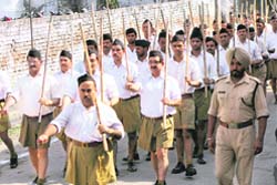 RSS volunteers, including transport minister Master Mohan Lal (extreme left) take part in a march to mark Vijay Divas in Pathankot