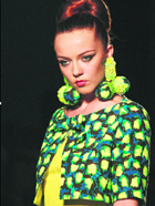 A model presents a creation by designer Vassilis Zoulias during the fashion week at Athens.