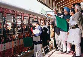 Prime Minister Manmohan Singh, with UPA chairperson Sonia Gandhi and railway minister Lalu Prasad Yadav, flags off the Kashmir train from the Nowgam railway station in Srinagar on Saturday.