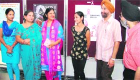Winners of a poster contest with office-bearers of the Chandigarh Breast Cancer Trust at Panjab University