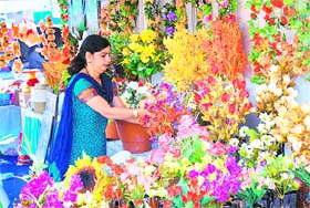 A bright looking stall at Exhibition Ground-34. (Below) Paintings on display
