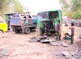 A vehicle being repaired in a park near Pratap Chowk in Ludhiana