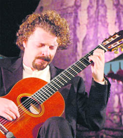 Italian guitarist Allessio Nebiolo and (right) Mohammed Ahmed Khan Warsi entertain the audience on the concluding day of the Virasat festival.
