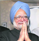 Manmohan Singh addresses the media on his flight to New Delhi after attending the Asia-Europe summit, on Saturday.